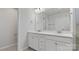 Bright bathroom features a double sink vanity with marble countertops at 419 Burr St, Indian Trail, NC 28079