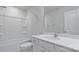 Bright bathroom with a shower-tub combo, white vanity, and modern fixtures at 419 Burr St, Indian Trail, NC 28079