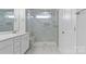 Bathroom featuring a marble-tiled glass shower with a built-in bench and a shower niche at 419 Burr St, Indian Trail, NC 28079