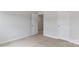 Neutral bedroom featuring a closet and a doorway leading to another room at 419 Burr St, Indian Trail, NC 28079