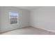 Bedroom features neutral carpeting and a window bringing in natural light at 419 Burr St, Indian Trail, NC 28079
