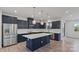 Modern kitchen featuring stainless steel appliances, ample counter space, and a large island at 419 Burr St, Indian Trail, NC 28079
