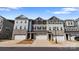 Charming townhomes boast a blend of stone and siding exteriors, with attached garages and inviting curb appeal at 419 Burr St, Indian Trail, NC 28079