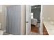 Bathroom featuring a tiled shower and a vanity with storage at 4543 Stonesthrow Dr, Denver, NC 28037