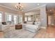 Inviting living room featuring a plush sectional sofa and elegant chandelier at 4543 Stonesthrow Dr, Denver, NC 28037