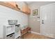 Charming mudroom with shiplap walls, storage solutions, and a welcoming entrance at 4543 Stonesthrow Dr, Denver, NC 28037