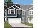 New home showcasing siding, a two-car garage, a driveway, and manicured grass at 6419 Mallow Crossing Ln, Charlotte, NC 28213