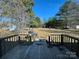 View of a spacious backyard and a deck with a grill perfect for outdoor entertaining at 7201 Gilead Rd, Huntersville, NC 28078
