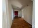 Hallway with hardwood flooring, leading to multiple rooms and allowing effortless flow throughout the home at 7201 Gilead Rd, Huntersville, NC 28078