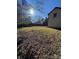 Spacious backyard with fencing and mature trees at 8730 Rittenhouse Cir, Charlotte, NC 28270