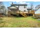 Home exterior with deck, screened porch, solar panels, and backyard at 8730 Rittenhouse Cir, Charlotte, NC 28270