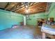 Unfinished basement featuring concrete floors, exposed ceiling, and pegboard wall at 8730 Rittenhouse Cir, Charlotte, NC 28270