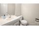 Half bath featuring a single vanity with light walls and wood-look floors at 8730 Rittenhouse Cir, Charlotte, NC 28270