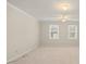 Bedroom with neutral carpet and two windows at 8730 Rittenhouse Cir, Charlotte, NC 28270