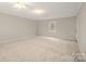 Bedroom featuring neutral carpet, ceiling fan, and window at 8730 Rittenhouse Cir, Charlotte, NC 28270