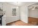 Dining area is brightly lit and includes wood floors, and window to the exterior at 8730 Rittenhouse Cir, Charlotte, NC 28270
