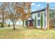 Well-maintained home with a red front door and beautifully landscaped yard at 8730 Rittenhouse Cir, Charlotte, NC 28270