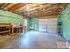 Garage interior with pegboard wall and overhead door at 8730 Rittenhouse Cir, Charlotte, NC 28270
