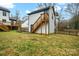 Garage exterior with stairs and wood fence at 8730 Rittenhouse Cir, Charlotte, NC 28270