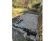 Backyard patio with stone accents at 8730 Rittenhouse Cir, Charlotte, NC 28270