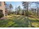 Expansive backyard with mature trees and a partial view of the home's exterior at 912 Silver Charm Ln, York, SC 29745