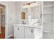 Bathroom boasting a white vanity with stylish fixtures, complemented by a dual-mirror setup and ample storage at 912 Silver Charm Ln, York, SC 29745