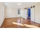 Large bright bedroom with hardwood floors, light neutral colors, and a barn door leading to the en-suite bathroom at 912 Silver Charm Ln, York, SC 29745