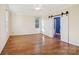 Spacious bedroom features beautiful hardwood floors and a sliding barn door to an en suite at 912 Silver Charm Ln, York, SC 29745