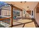 Enjoy the outdoors from this covered deck with wood flooring, ceiling fan, and decorative canopy at 912 Silver Charm Ln, York, SC 29745