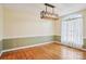 Bright dining room features hardwood floors, large windows, and modern light fixtures at 912 Silver Charm Ln, York, SC 29745