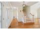 Spacious entryway with hardwood floors, a decorative glass door, and a staircase leading upstairs at 912 Silver Charm Ln, York, SC 29745