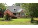 Charming brick home with a well-manicured lawn and lush landscaping, offering great curb appeal at 912 Silver Charm Ln, York, SC 29745