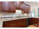 Charming kitchen featuring granite countertops, stainless appliances, and custom cabinets for ample storage at 912 Silver Charm Ln, York, SC 29745