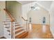 Bright living room featuring hardwood floors, high ceilings, a staircase, and French doors to the backyard at 912 Silver Charm Ln, York, SC 29745