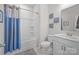 Bright bathroom featuring a shower-tub combo and a modern vanity with white cabinets at 9804 Ainslie Downs St, Charlotte, NC 28273