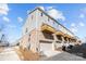 Multi-story townhome with private garages and wooden decks, offering modern living and convenience at 9804 Ainslie Downs St, Charlotte, NC 28273