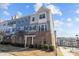 Charming multi-story townhome featuring a brick facade, landscaped yard and desirable neighborhood amenities at 9804 Ainslie Downs St, Charlotte, NC 28273