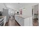 Bright kitchen with stainless steel appliances, granite countertops, spacious island and an open-concept layout at 9804 Ainslie Downs St, Charlotte, NC 28273