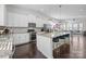 Bright kitchen with stainless steel appliances, granite countertops, spacious island and an open-concept layout at 9804 Ainslie Downs St, Charlotte, NC 28273
