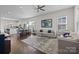 Spacious living room open to the kitchen and dining area, perfect for entertaining at 9804 Ainslie Downs St, Charlotte, NC 28273