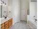Bathroom featuring a vanity with a sink, a bathtub, and a shower at 10032 Montrose Nw Dr, Charlotte, NC 28269