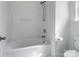 Clean white bathroom with a shower-tub combination and modern fixtures at 10032 Montrose Nw Dr, Charlotte, NC 28269
