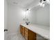Modern bathroom featuring a long vanity, large mirror, and sleek fixtures at 10032 Montrose Nw Dr, Charlotte, NC 28269