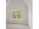 Bright bedroom with vaulted ceilings, a large window, and neutral-colored carpeting at 10032 Montrose Nw Dr, Charlotte, NC 28269