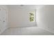 Spacious bedroom featuring a window with green leafy views and a closet at 10032 Montrose Nw Dr, Charlotte, NC 28269