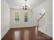 Bright dining room with hardwood floors, large windows, and classic trim at 10032 Montrose Nw Dr, Charlotte, NC 28269
