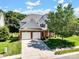 Charming two-story home with a well-manicured lawn, two-car garage, and a mix of brick and siding exterior at 10032 Montrose Nw Dr, Charlotte, NC 28269