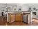 Cozy kitchen featuring wood cabinets, granite counters, and an island with a sink at 10032 Montrose Nw Dr, Charlotte, NC 28269