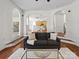 Spacious living room with hardwood floors and lots of natural light at 10032 Montrose Nw Dr, Charlotte, NC 28269