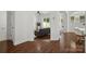View of open living room with hardwood floors at 10032 Montrose Nw Dr, Charlotte, NC 28269